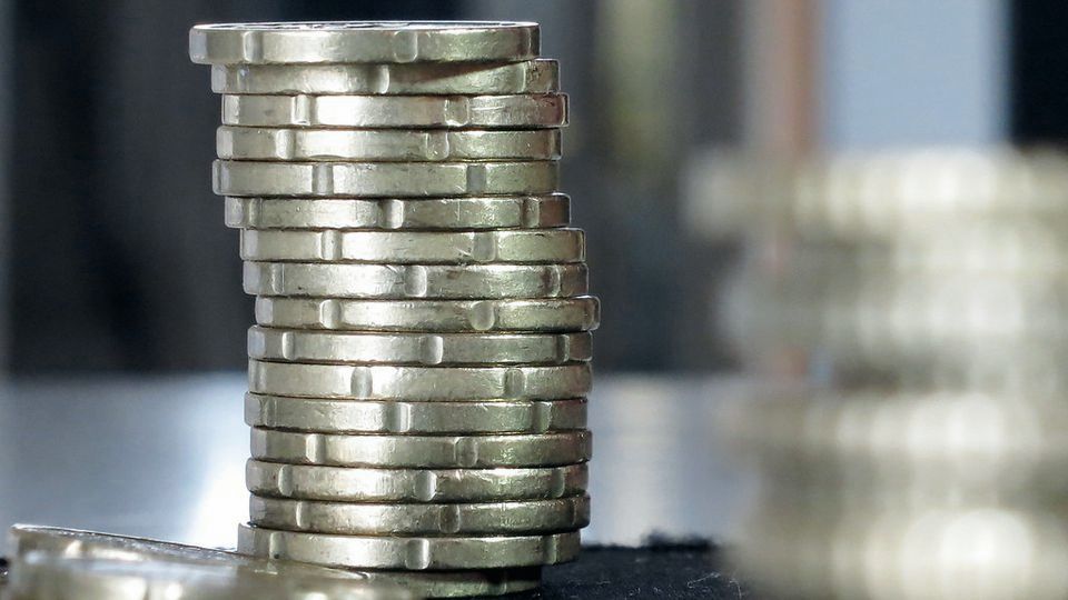 Stacks of coins standing on a table